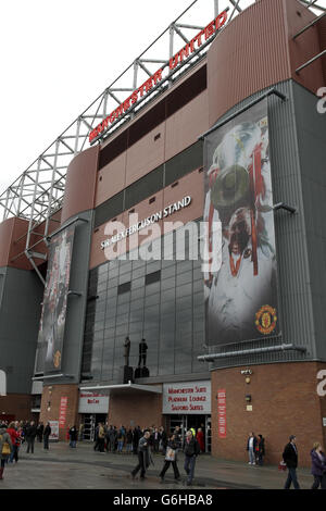 A statue of Manchester United manager Sir Alex Ferguson outside the stand named after him at Old Trafford, Manchester.