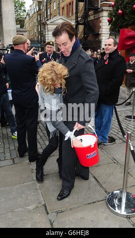 Strictly contestants selling poppies in London Stock Photo