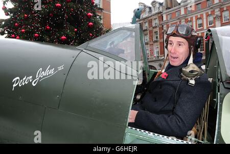 Anton du Beke sits in a Spitfire while selling poppies in Covent Garden, London. Stock Photo