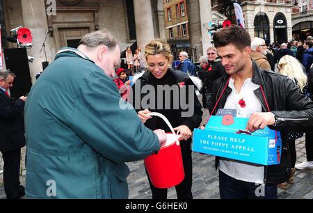 Aljaz Skorjanec and Abbey Clancy selling poppies in Covent Garden, London. Stock Photo