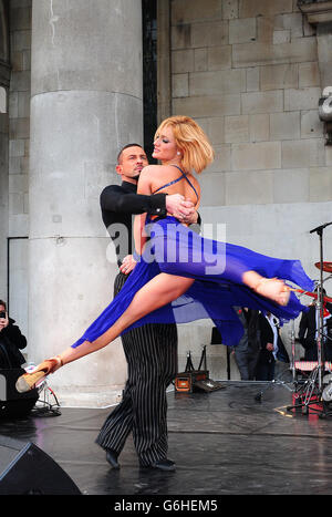 Aliona Vilani and Robin Windsor perform while Strictly Come Dancing contestants and their partners sell poppies in Covent Garden, London. Stock Photo
