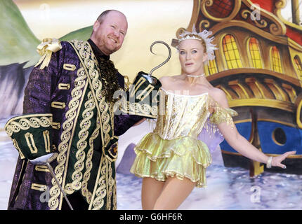 Eastenders actor Steve McFadden, who plays Captain Hook, with Penni Tovey, who plays Tinkerbell, pose for photographers during a photocall for the pantomime Peter Pan at the New Victoria Theatre in Woking, Surrey. The pantomime starts on Thursday 11 December 2003. Stock Photo