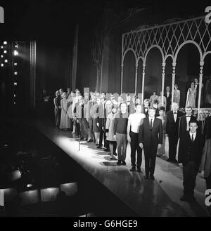 Famous faces turn towards the empty Royal Box during finale rehearsals at the London Palladium in preparation for tonights Royal Variety Show being attended there by the Queen. Some of the faces can be recognised as those of Peter Cooke and Dudley Moore (half way up on the left ), Shirley Bassey, Dave Clarke and his Five, Ken Dodd and many others. Stock Photo