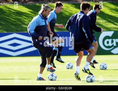 (Left to right) David Beckham, John Terry, Gary Neville and Frank Lampard join in with an England training session at Arsenal's training ground at London Colney, Herts, as the squad prepared to fly to Istanbul for the Euro 2004 qualifying match against Turkey this weekend. England must avoid defeat on Saturday to guarantee their place in next year's tournament. See PA story SOCCER England. Stock Photo