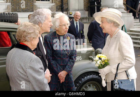 Britain's Queen Elizabeth II talks to Betty Royle from London, Pat Blake (left) from Surrey and Patsie Young (2nd left) from Dorset, at the Imperial War Museum. The three women served with Her Majesty in the ATS during the second World War. The vehicle is a 1940 Austin Utility owned by Mr. John Simpson. * The Queen was reunited with her Wartime collegues after opening the Women in War exhibition at the Museum, which highlights the vital work that they did to help the War effort. Stock Photo