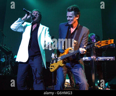 Lead singer Simon Le Bon (left) and John Taylor from Duran Duran performs live on stage for their first UK concert in 18 years at The Forum in London. Stock Photo