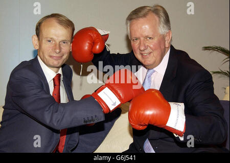 BBC Political Editor Andrew Marr (left) and Conservative London Mayoral Candidate Steve Norris play-fight with boxing gloves during a photocall for Cancer Research UK's 'Turn the Tables' event at The Savoy Hotel in central London. The event which gives MPs the chance to reverse the roles and cross-question media journalists aims to raise funds for Cancer Research UK. Stock Photo