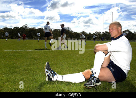 Wales's Brent Cockbain stretches during training at the Canberra Raiders training fields, ahead of their Rugby Union World Cup pool match against Italy at The Bruce Stadium, Canberra on Saturday. NO MOBILE PHONE USAGE. INTERNET SITES MAY ONY USE ONE IMAGE EVERY FIVE MINUTES DURING MATCH. Stock Photo