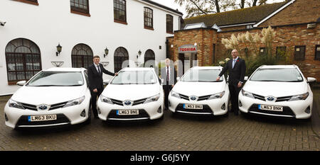 Staff at Toshiba in Chertsey, Surrey with some of their new fleet of Toyota Auris hybrid estate cars. PRESS ASSOCIATION Photo. Picture date: Monday November 11, 2013. Left to right: Jeremy Spencer, Marketing Director, Brian Goddard, Fleet Manager and Jonathan Barber, UK Service Director. Photo credit should read: Chris Ison/PA Wire. Stock Photo