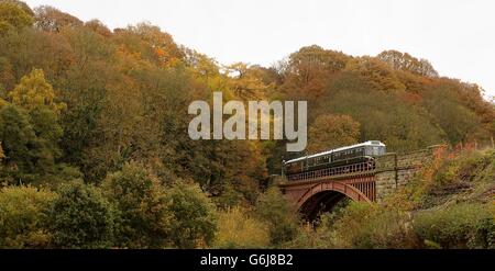 A diesel engine train crosses the Victoria Bridge over the River Severn between Bewdley and Arley on the Severn Valley Railway, Worcestershire.