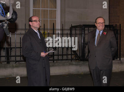 Conservative Party MP Michael Ancram (right) prepares to give a televsion interview outside the Conservative Central Office in central London. Mr Ancram was set to comment on the future of the Conservative Party leader Iain Duncan-Smith whose leadership is again under close scrutiny. Stock Photo