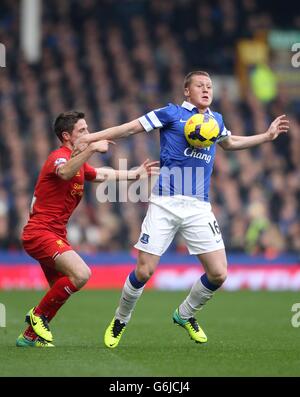 Everton's James McCarthy (left) and Liverpool's Philippe Coutinho ...