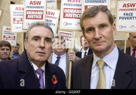 L-R: ISTC General Secretary Michael Leahy and Amicus Assistant General Secretary Paul Talbot outside Richmond House, Whitehall accompanied by former ASW workers, as they deliver a writ to the Department of Work and Pensions headquarters in London. The unprecedented action is being taken in support of 1,000 workers who lost their jobs earlier this year when steel firm ASW, which had factories in Cardiff and Sheerness, Kent, fell into receivership. Stock Photo