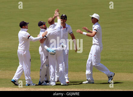 England's Ben Stokes (centre) celebrates taking the wicket of Australia's Michael Clarke (not pictured) for 148 during day two of the Second Test Match at the Adelaide Oval, Adelaide, Australia. Stock Photo