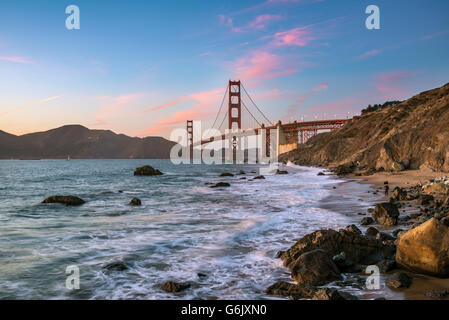 Dusk at Golden Gate Bridge, Marshall's Beach, rocky coast, San Francisco, USA, North America Stock Photo