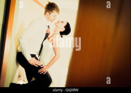 Bridal couple in a hotel room Stock Photo