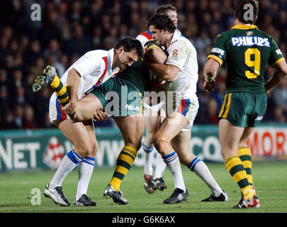 Australia's Shane Webcke is stopped by Great Britain captain Andy Farrell (right) and Paul Sculthorpe in the Second Rugby League Test Match at the KC Stadium, Hull Saturday November 15 2003. Stock Photo