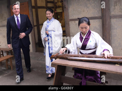 Prime Minister David Cameron is shown around the home of the Chinese author and poet Du Fu in Chengdu today, as part of his three day visit to China.