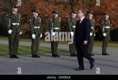 Minister for Public Expenditure Brendan Howlin inspects during the commemorative wreath-laying ceremony for the former United States President John F Kennedy, on the 50th anniversary of his death at the JFK Memorial Park and Arboretum in New Ross, Co Wexford, the ancestral home of President Kennedy.