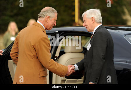 The Prince of Wales shakes hands with Royal Agricultural University Principal Professor Chris Gaskell, as he leaves the University's Rural Innovation Centre at Manor Farm in Gloucestershire. Stock Photo