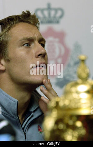 World Cup hero Jonny Wilkinson sits with the William Web Ellis trophy during at a news conference at Penny Hill Park Hotel near Bagshot after the England rugby team returned from Sydney. Earlier, thousands of rugby fans were at Heathrow Airport to welcome home the team that beat Australia in extra time on Saturday to win the trophy. Stock Photo