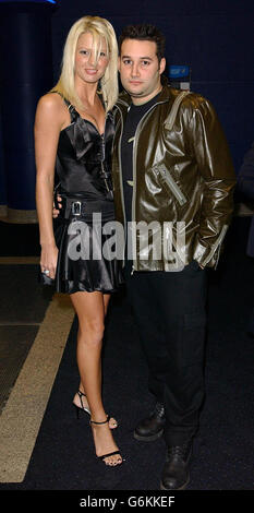 Singer Dane Bowers and his girlfriend Lucy Mortimer arrives for the UK premiere of Shoreditch at Warner West End in central London. The film is a crime thriller set in 1930's London and the present day and sees Eastenders actor Shane Richie in his big screen debut. Stock Photo