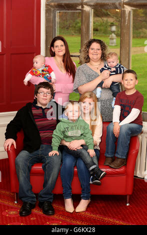 Louise Brown (top right), the world's first test tube baby, with her sister Natalie (top left) and their children (back row left to right) Aeron Derrick, 15 weeks and Aiden Brown 15 weeks, (front row left to right)Christopher Derrick, 12, Daniel Derrick, 8, Casey Derrick 14, and Cameron Brown, 6, at the Bourne Clinic in Cambridgeshire, after planting a tree in memory of her mother and father who were the first parents to have a child using IVF. Stock Photo