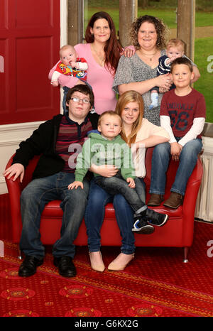 Louise Brown (top right), the world's first test tube baby, with her sister Natalie (top left) and their children (back row left to right) Aeron Derrick, 15 weeks and Aiden Brown 15 weeks, (front row left to right)Christopher Derrick, 12, Daniel Derrick, 8, Casey Derrick 14, and Cameron Brown, 6, at the Bourne Clinic in Cambridgeshire, after planting a tree in memory of her mother and father who were the first parents to have a child using IVF. Stock Photo