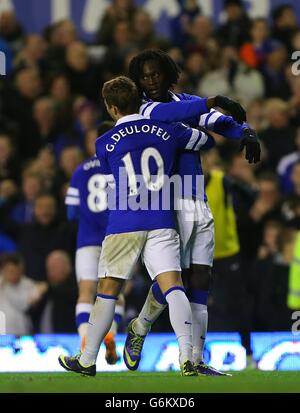 Everton's Romelu Lukaku (right) celebrates scoring his side's fourth goal of the game with teammate Gerard Deulofeu (left) Stock Photo