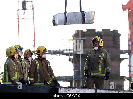 Emergency services remove wreckage as work to recover bodies from the Clutha Vaults pub in Stockwell Street close to Glasgow city centre continues, following the deaths of at least eight people - including the civilian pilot and two police officers of a police helicopter that crashed into the building on Friday evening. Stock Photo