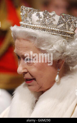 Queen Elizabeth II makes her way from the Sovreign's entrance, up the stairs towards the Norman porch, ahead of making the Queen's Speech, to members of the House of Lord and the House of Commons during the State Opening of Parliament in London. Seated on the Throne in the House of Lords, she formally announced the UK Government's legislative programme for the new parliamentary session. Stock Photo