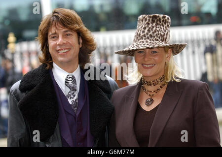 Interior designer Laurence Llewelyn Bowen and his wife Jackie arrive at the ceremony for the Woman's Own Child of Courage award held at Westminster Abbey in London. Stock Photo