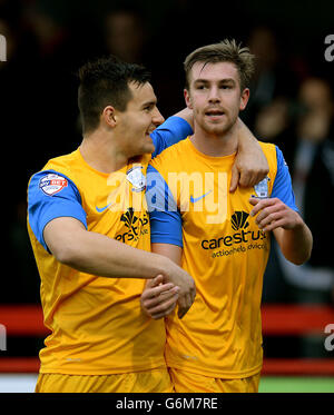 Preston North End's Paul Huntington (right) is congratulated by his team mate Bailey Wright after scored the opening goal during the Sky Bet League One match at the Checktrade.com Stadium, Crawley. Stock Photo