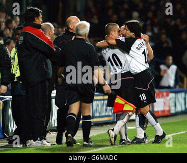 Fulham players celebrate in front of their manager Chris Coleman (L) after scoring against Bolton Wanderers during the Barclaycard Premiership match at Loftus Road, west London. Stock Photo