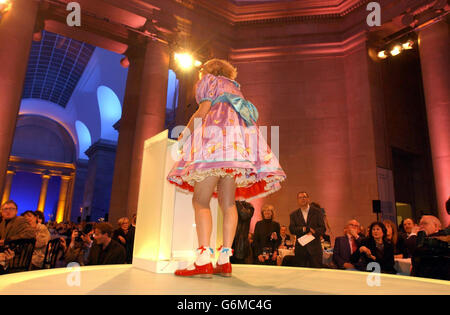 Winner of the Turner Prize, transvestite potter Grayson Perry dressed as his alter ego Claire, during the presentation ceremony at Tate Britain in London. The decision to grant Perry the award marks a rare Turner victory for traditional arts, as the winner puts his own spin on an ancient decorative form. Stock Photo