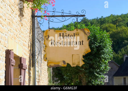 commercial sign a hotel restaurant in the tourist village of Saint-Amand-de-Coly in the French Dordogne Stock Photo