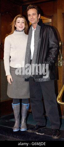 Actors Alyson Hannigan and Luke Perry pose for photographers during a photocall and press launch for their new stage adaptation of 1989's romantic comedy film When Harry Met Sally outside the Theatre Royal in London's Hatmarket. Stock Photo