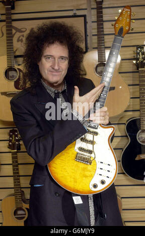 Queen guitarist Brian May, who officially opened the new House of Guitars store, in Brune Street, central London. May holds a custom built Burns Brian May Honey Sunburst guitar. Stock Photo