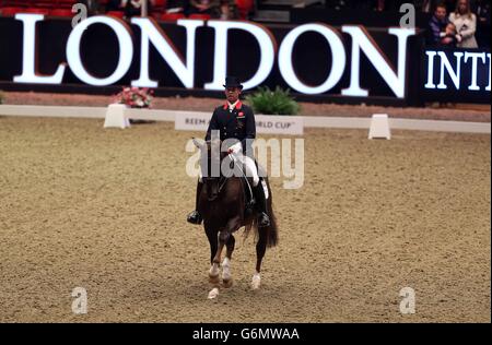 Great Britain's Carl Hester riding Fine Time 13 competes in the REEM ACRA FEI World Cup Dressage Grand Prix during The London International Horse Show, at the Olympia Exhibition Hall, West Kensington, London. Stock Photo