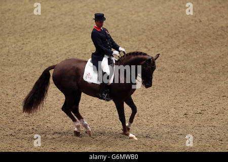 Great Britain's Carl Hester riding Fine Time 13 competes in the REEM ACRA FEI World Cup Dressage Grand Prix during The London International Horse Show, at the Olympia Exhibition Hall, West Kensington, London. Stock Photo