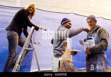 Interior designer Linda Barker is joined by Khristian (centre) and John from the Crisis Skylight Homeless Activity Centre in east London, to decorate the interior of the Crisis Open Christmas Shelter in Southwark, south east London. Stock Photo