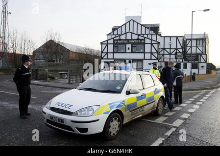 Police officers stand on guard outside the Royal Hotel in Dunston, Gateshead, where the suspect is believed to be held in connection with the murder of Pc Ian Broadhurst and the attempted murder of two of his colleagues, police said today. West Yorkshire Police said the man, in his late 30s, was arrested in the north east of England following a tip-off from a member of the public. Stock Photo
