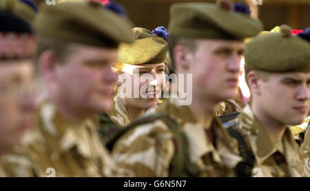 Territorial Army troops - including Private Jolene MacKay (centre), a store assistant from Wick - from the 51st Highland Regiment, leave their Perth Headquarters, their families and jobs for a four-month tour of duty in Iraq. Around 80 Highland troops will be based in Basra, where they will guard the Shaibah airfield in the south west of the city. Stock Photo