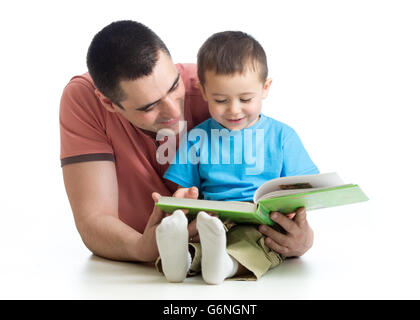 child boy and father read a book on floor at home Stock Photo