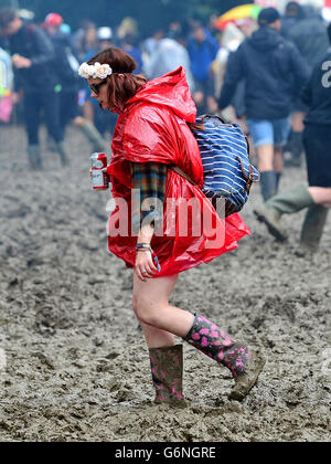 A festivalgoer in the mud at the Glastonbury Festival, at Worthy Farm in Somerset. PRESS ASSOCIATION Photo. See PA story SHOWBIZ Glastonbury. Picture date: Friday June 24, 2016. Photo credit should read: Ben Birchall/PA Wire Stock Photo