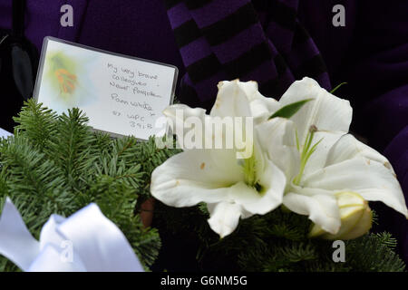 Former police officer Pam White, who was standing next to her colleague Constable Jane Arbuhnot, who died when a car bomb exploded outside Harrods, leaves a floral tribute, as she attends a memorial service at the Harrods Bombing memorial, on the 30th anniversary of the terrorist attack which left three Police Officers and three members of the public dead, on December 17, 1983, outside the landmark department store in west London. Stock Photo