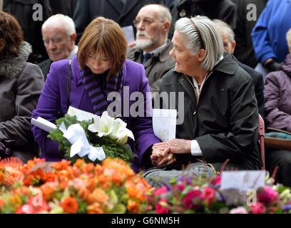 Former police officer Pam White (left), who was standing next to her colleague Constable Jane Arbuhnot, when a car bomb exploded outside Harrods, with Jane's mother Susan Arbuthnot, as they attend a memorial service at the Harrods Bombing memorial, on the 30th anniversary of the terrorist attack which left three Police Officers and three members of the public dead, on December 17, 1983, outside the landmark department store in west London. Stock Photo