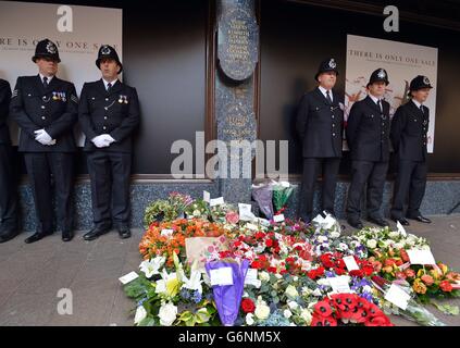 Police officers attend the memorial service at the Harrods Bombing memorial, on the 30th anniversary of the terrorist attack which left three Police Officers and three members of the public dead, on December 17, 1983, outside the landmark department store in west London. Stock Photo