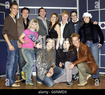 Pop Idol winners from 11 countries pose for photographers during a photocall to announce the forthcoming show ITV's 'World Idol', from left to right; Alexander Klaws from Germany, Jamai from Norway, Alex Janosz from Poland (pink top), Will Young from the UK, Guy Sebastian from Australia, Kelly Clarkson from the USA, Kurt Nilsen from Norway, Peter Evrard, from Belgium, Ryan Malcolm from Canada, Heinz Winckler from South Africa and Diana Karzon from the Pan Arabic Region and at Fountain Studios in Wembley, north London. The special two-part show will be transmitted on December 25th and January Stock Photo