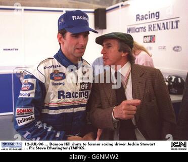 Motor Racing. British Grand Prix. 12-JUL-96. Damon Hill chats to former racing driver Jackie Stewart Stock Photo